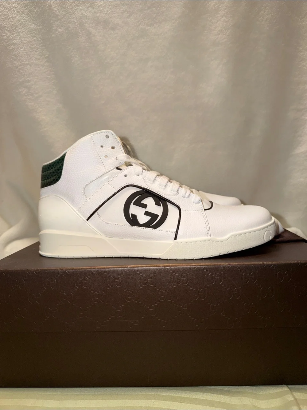 Gucci White Leather Low-Top Sneakers with Red Logo Sole.